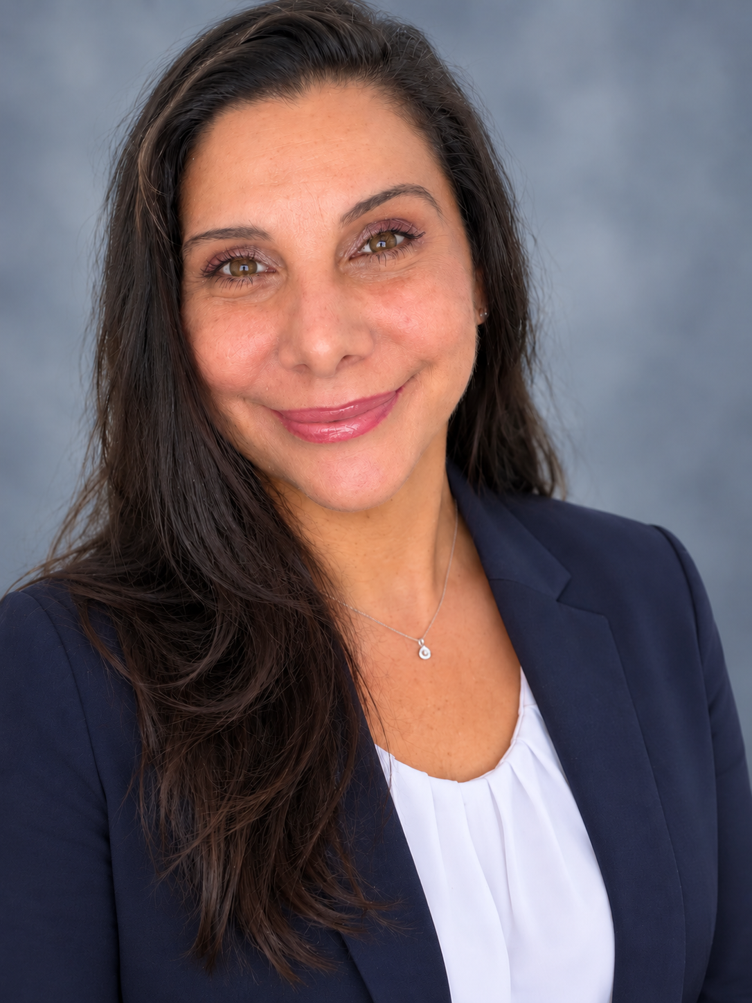Sara Spencer wearing a navy blazer